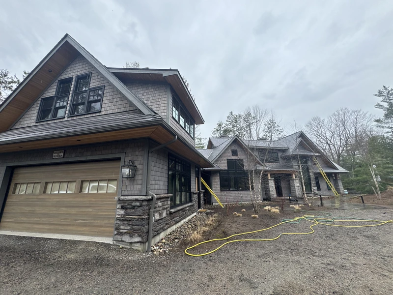 Front view of a home in Hamilton with freshly cleaned siding after soft washing service.